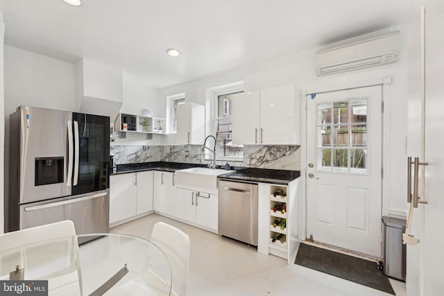 251 S 46th St, Philadelphia, PA 19139 - kitchen with a wall unit AC, a sink, open shelves, white cabinets, and appliances with stainless steel finishes