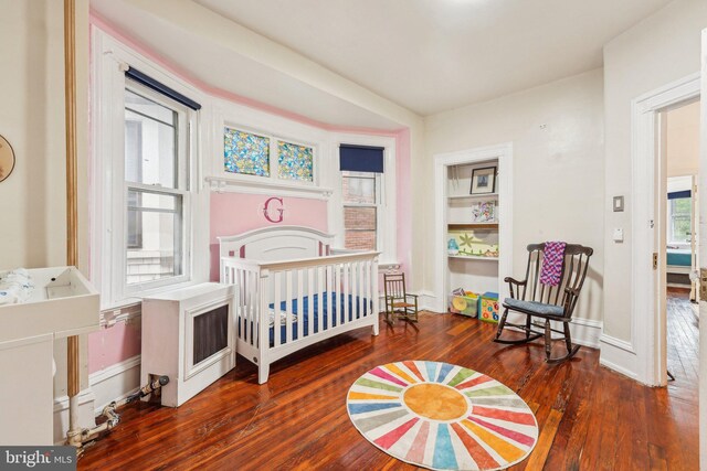251 S 46th St, Philadelphia, PA 19139 - bedroom with baseboards and wood finished floors