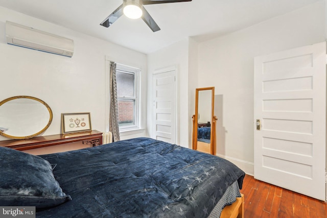 251 S 46th St, Philadelphia, PA 19139 - bedroom featuring ceiling fan, a wall mounted AC, and hardwood / wood-style flooring
