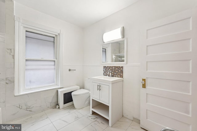 251 S 46th St, Philadelphia, PA 19139 - bathroom with radiator, toilet, marble finish floor, and vanity