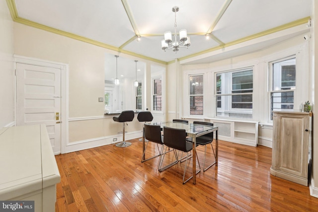 251 S 46th St, Philadelphia, PA 19139 - interior space featuring ornamental molding, a notable chandelier, a healthy amount of sunlight, and light wood-type flooring