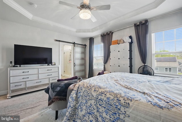 131 Boxelder Dr, Stafford, VA 22554 - bedroom featuring a barn door, ceiling fan, a tray ceiling, crown molding, and baseboards