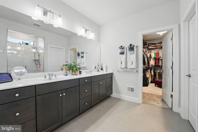 131 Boxelder Dr, Stafford, VA 22554 - bathroom with tile patterned floors, a shower stall, double vanity, a sink, and visible vents