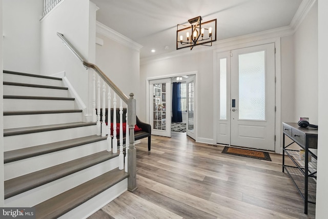 131 Boxelder Dr, Stafford, VA 22554 - foyer entrance with crown molding, a notable chandelier, stairway, and wood finished floors