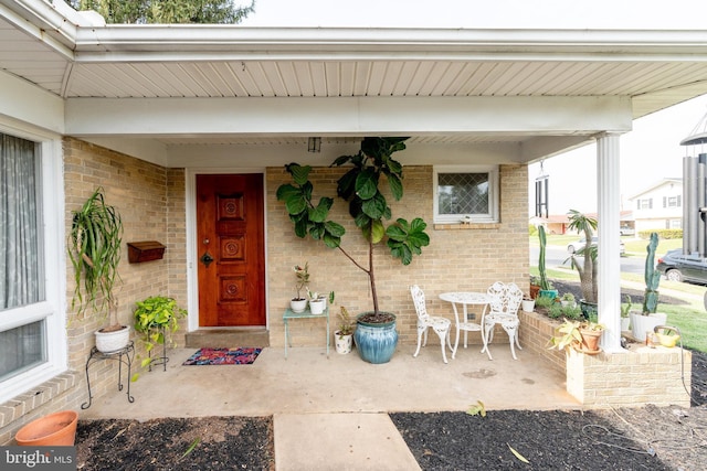 property entrance with brick siding