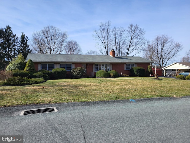 212 University Dr, Mont Alto, PA 17237 - single story home featuring a front lawn and a chimney