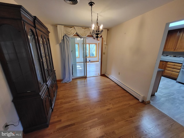 212 University Dr, Mont Alto, PA 17237 - dining area featuring baseboards, visible vents, light wood-style floors, a baseboard heating unit, and an inviting chandelier