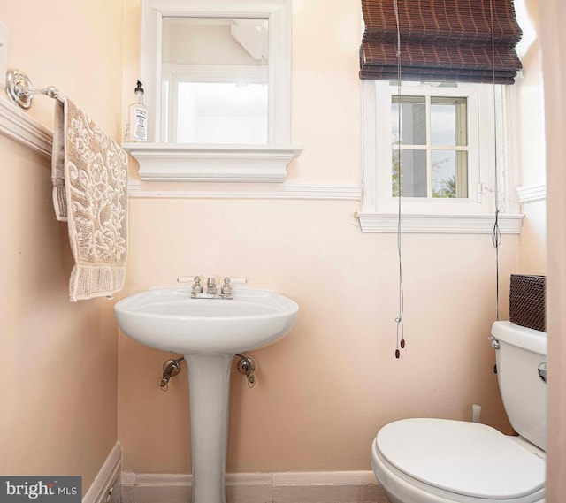 half bath featuring toilet