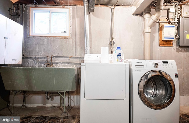 laundry room featuring separate washer and dryer and electric panel