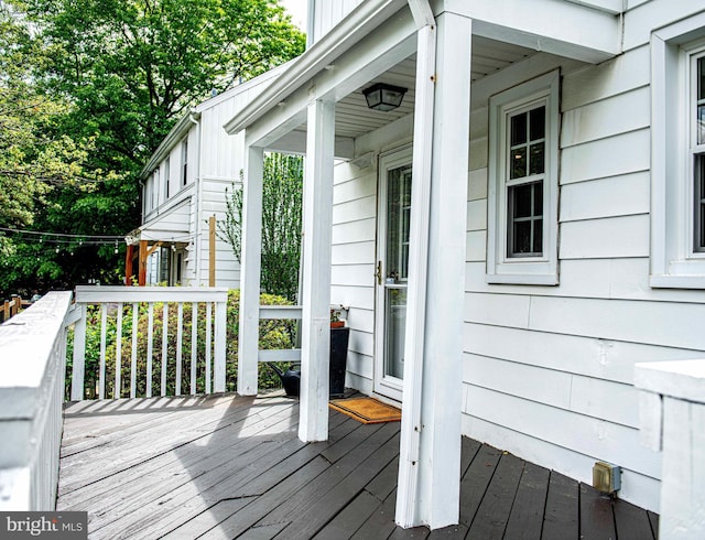 wooden terrace featuring a porch