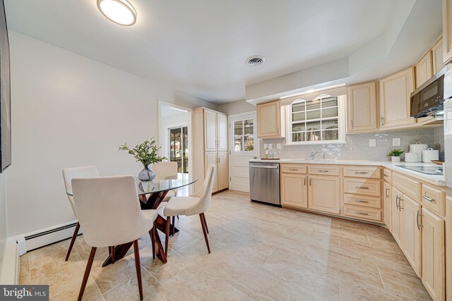 kitchen featuring stainless steel dishwasher, visible vents, a sink, and light brown cabinets