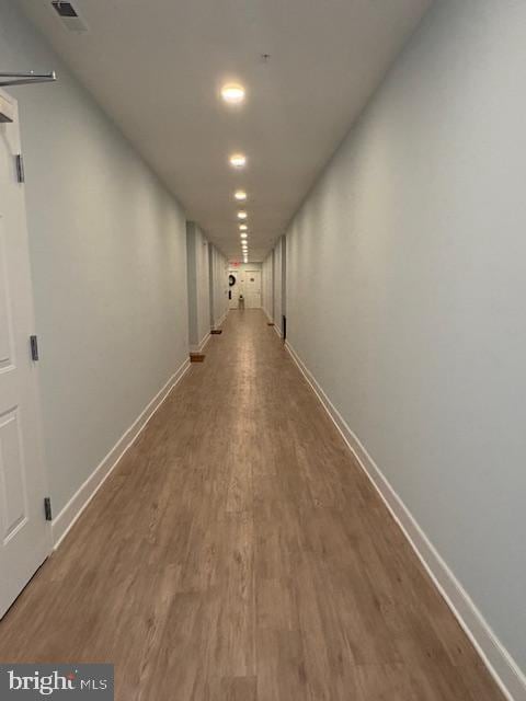 30609 Cedar Neck Rd Unit 3109, Ocean View, DE 19970 - hallway with baseboards, visible vents, and wood finished floors