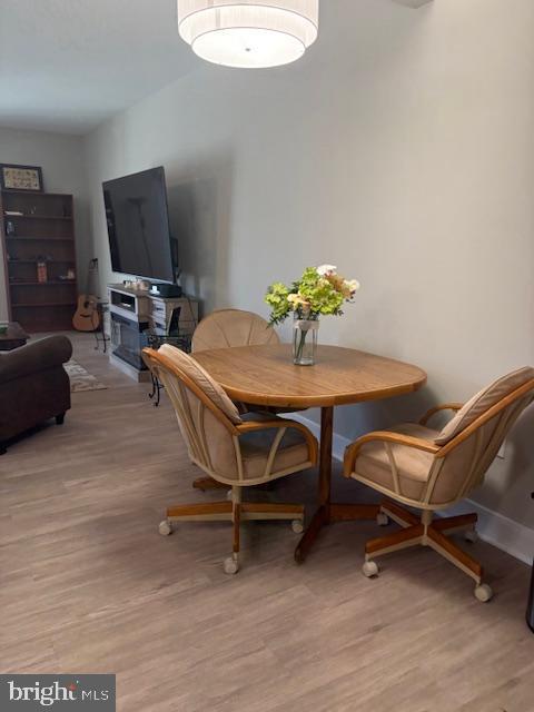 30609 Cedar Neck Rd Unit 3109, Ocean View, DE 19970 - dining room with baseboards and light wood-style flooring