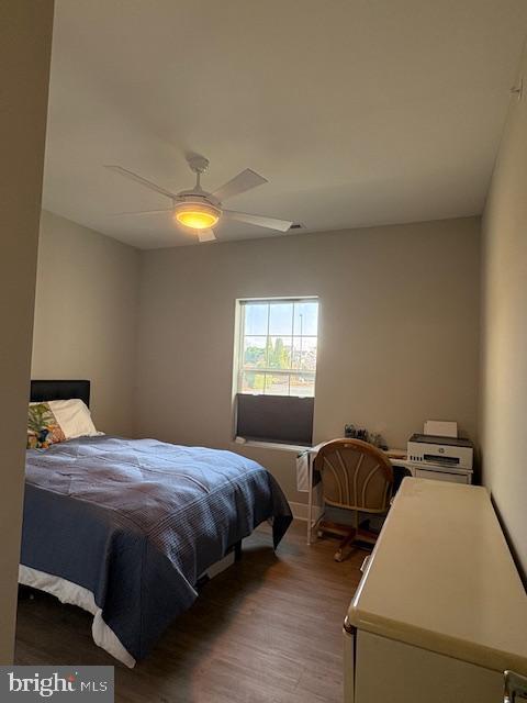 30609 Cedar Neck Rd Unit 3109, Ocean View, DE 19970 - bedroom featuring ceiling fan and wood finished floors