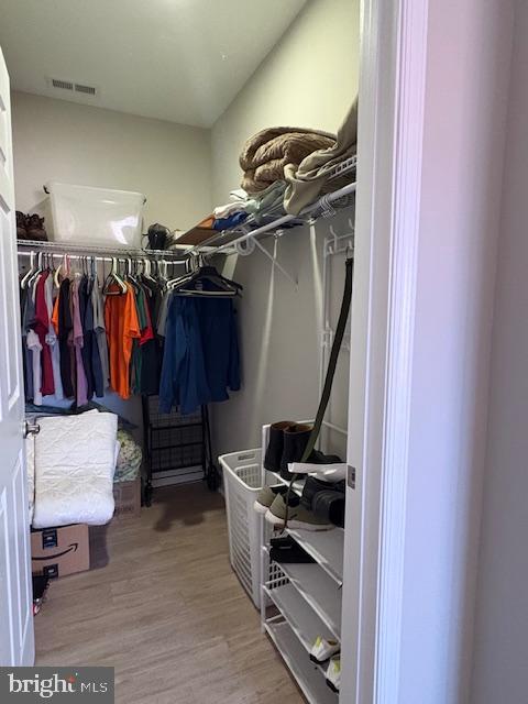 30609 Cedar Neck Rd Unit 3109, Ocean View, DE 19970 - walk in closet with visible vents and wood finished floors