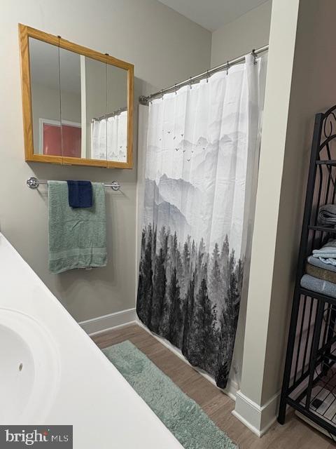 30609 Cedar Neck Rd Unit 3109, Ocean View, DE 19970 - full bath with wood finished floors and curtained shower