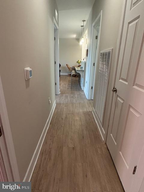 30609 Cedar Neck Rd Unit 3109, Ocean View, DE 19970 - corridor with baseboards and wood finished floors