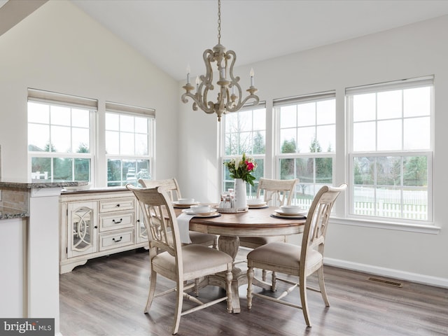 162 Blackford Dr, Stephenson, VA 22656 - dining room featuring dark wood-style flooring, visible vents, an inviting chandelier, and a healthy amount of sunlight