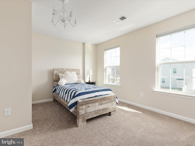 162 Blackford Dr, Stephenson, VA 22656 - carpeted bedroom with baseboards, a chandelier, and visible vents