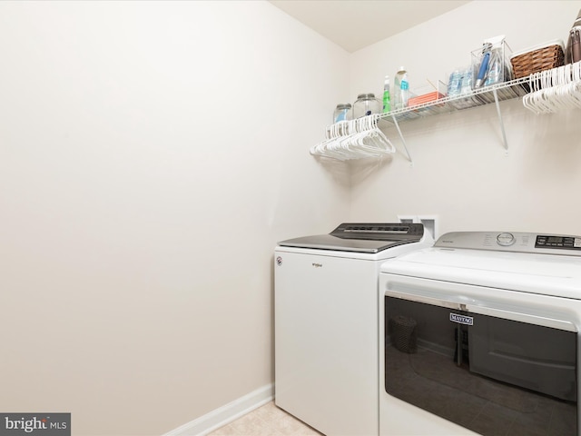 162 Blackford Dr, Stephenson, VA 22656 - laundry area with washing machine and clothes dryer, baseboards, and laundry area