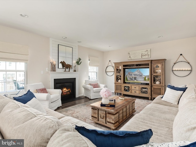 162 Blackford Dr, Stephenson, VA 22656 - living room featuring a fireplace with flush hearth, wood finished floors, and recessed lighting