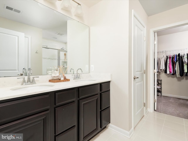 162 Blackford Dr, Stephenson, VA 22656 - bathroom featuring a shower stall, double vanity, visible vents, and a sink