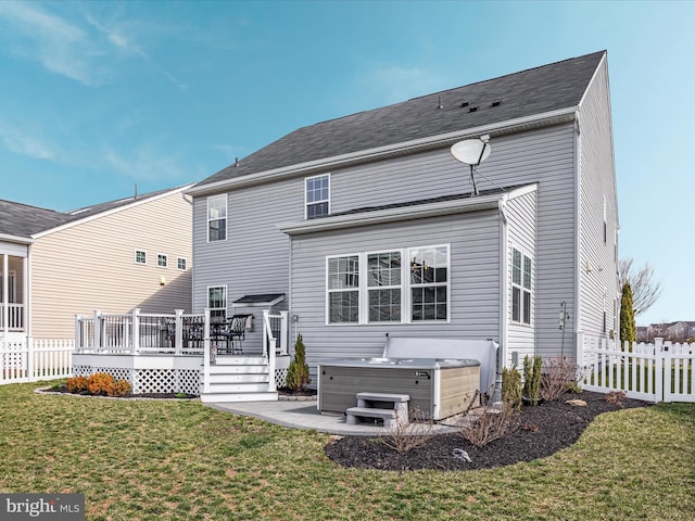 162 Blackford Dr, Stephenson, VA 22656 - back of house featuring a wooden deck, fence, a hot tub, and a lawn