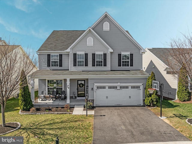 162 Blackford Dr, Stephenson, VA 22656 - traditional-style house featuring driveway, an attached garage, covered porch, and a front yard