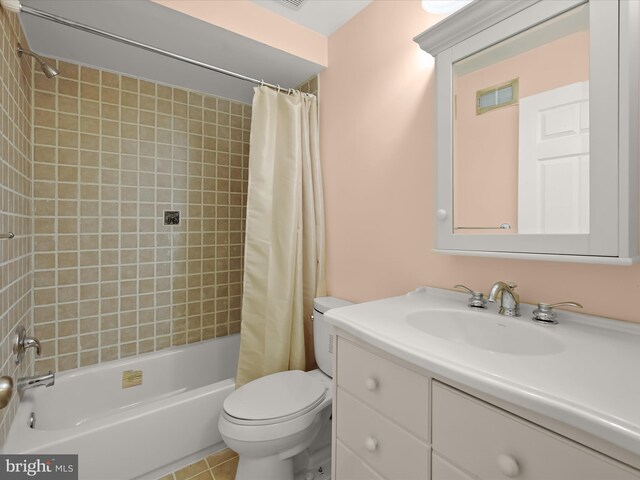 full bathroom featuring tile patterned floors, toilet, vanity, shower / tub combo, and visible vents