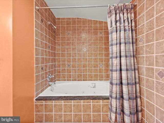 full bath featuring a combined bath / shower with jetted tub