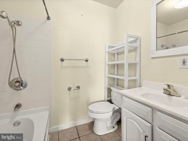 full bath with vanity, toilet, baseboards, tile patterned floors, and tub / shower combination