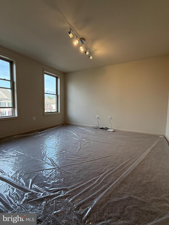 empty room featuring track lighting