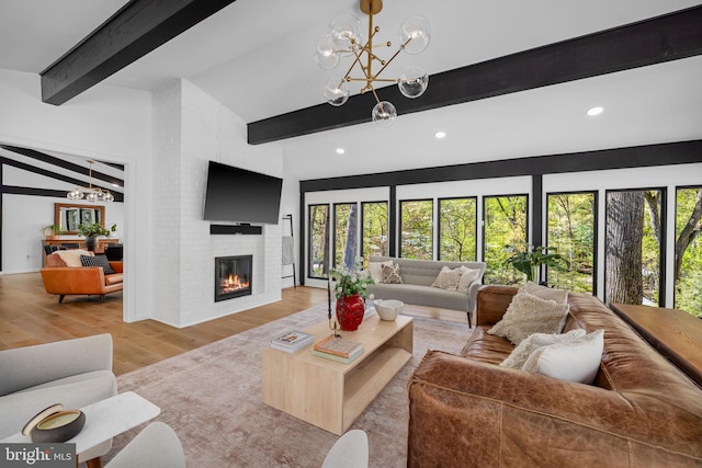 1335 N Pegram St N, Alexandria, VA 22304 - living room featuring a healthy amount of sunlight, wood finished floors, beam ceiling, and a chandelier