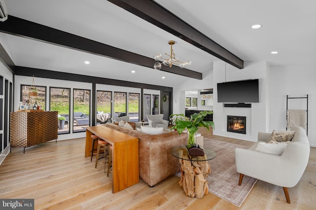 1335 N Pegram St N, Alexandria, VA 22304 - living area featuring vaulted ceiling with beams, a brick fireplace, a healthy amount of sunlight, and an inviting chandelier