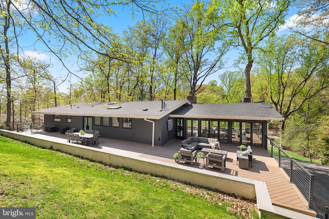 1335 N Pegram St N, Alexandria, VA 22304 - rear view of house with a chimney, a lawn, a deck, outdoor lounge area, and a shingled roof