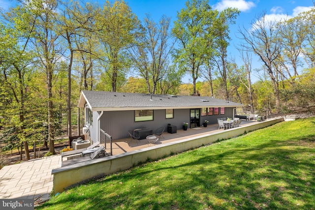 1335 N Pegram St N, Alexandria, VA 22304 - rear view of house featuring a lawn, roof with shingles, and a deck