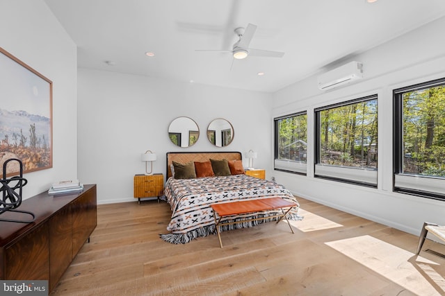 1335 N Pegram St N, Alexandria, VA 22304 - bedroom featuring multiple windows, light wood-style flooring, and a wall mounted air conditioner