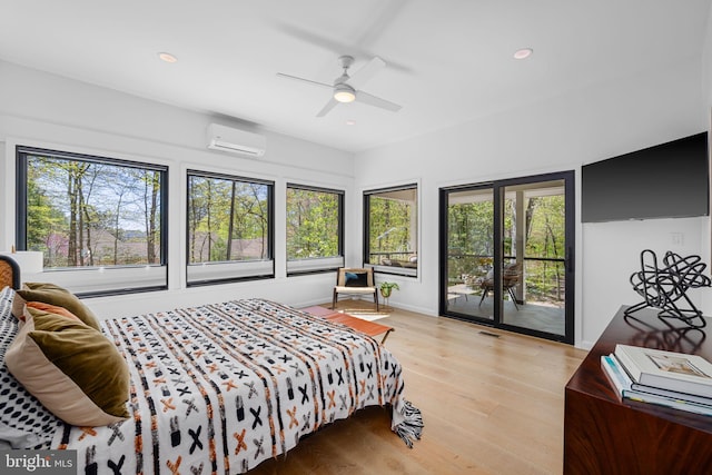 1335 N Pegram St N, Alexandria, VA 22304 - bedroom with access to outside, a wall unit AC, multiple windows, and wood finished floors