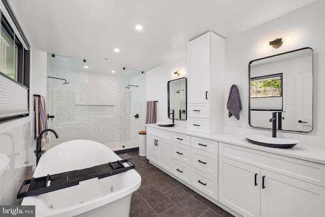 1335 N Pegram St N, Alexandria, VA 22304 - full bath featuring double vanity, tile patterned floors, a soaking tub, a sink, and a stall shower