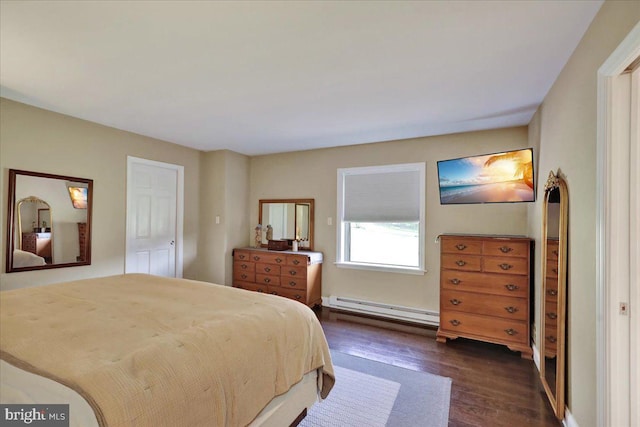 bedroom with dark wood finished floors and a baseboard radiator