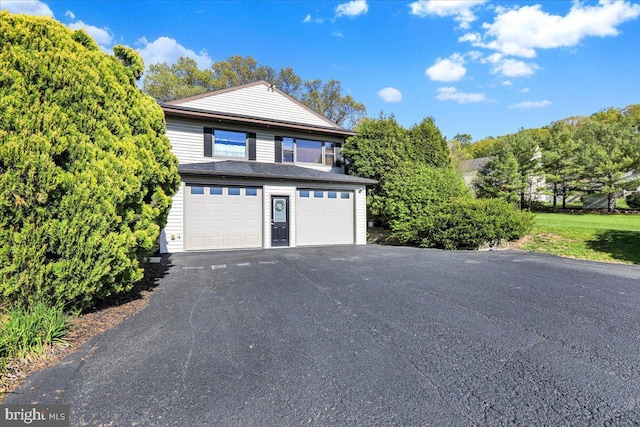 exterior space with a garage and driveway