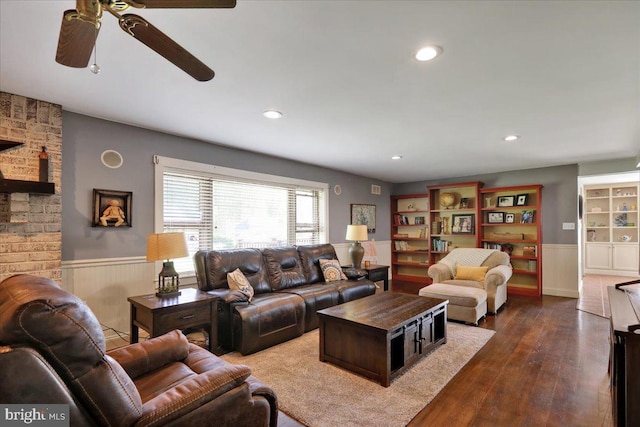 living room with ceiling fan, wainscoting, recessed lighting, and dark wood-type flooring