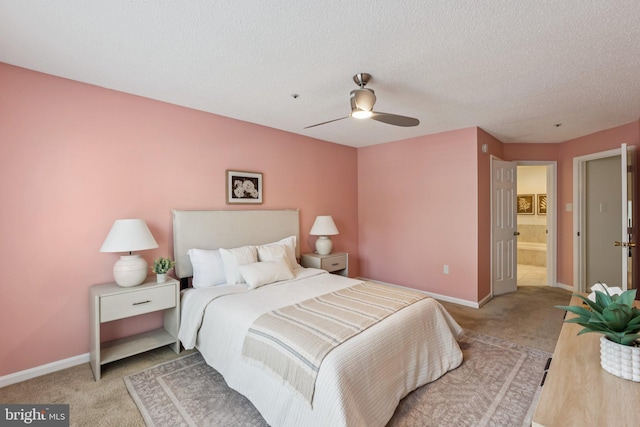 249 S Pickett St Unit 302, Alexandria, VA 22304 - bedroom featuring carpet floors, baseboards, a textured ceiling, ensuite bath, and ceiling fan