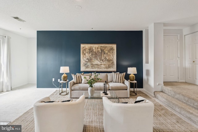 249 S Pickett St Unit 302, Alexandria, VA 22304 - living area featuring carpet, baseboards, and a textured ceiling