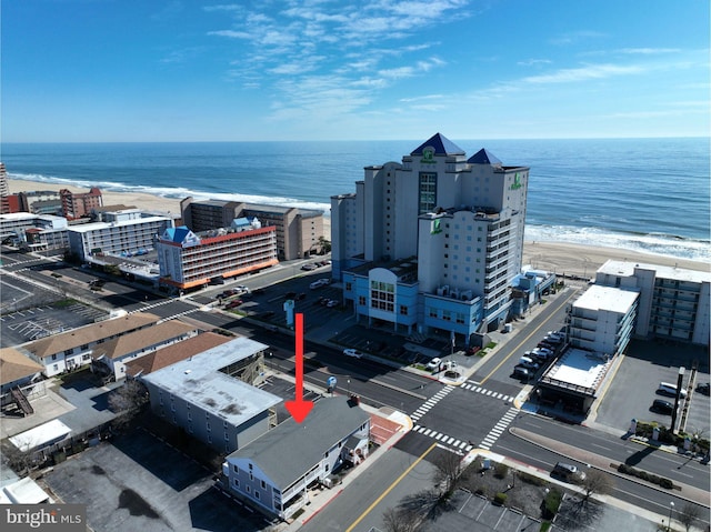 aerial view with a view of the beach and a water view