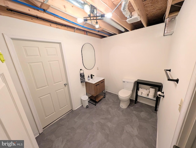 interior space featuring toilet and vanity