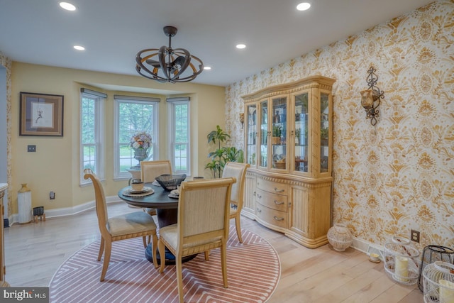 dining area featuring wallpapered walls, baseboards, recessed lighting, light wood-style flooring, and a chandelier
