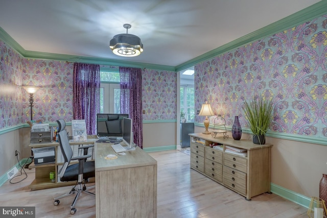 office with wallpapered walls, plenty of natural light, ornamental molding, wood finished floors, and baseboards