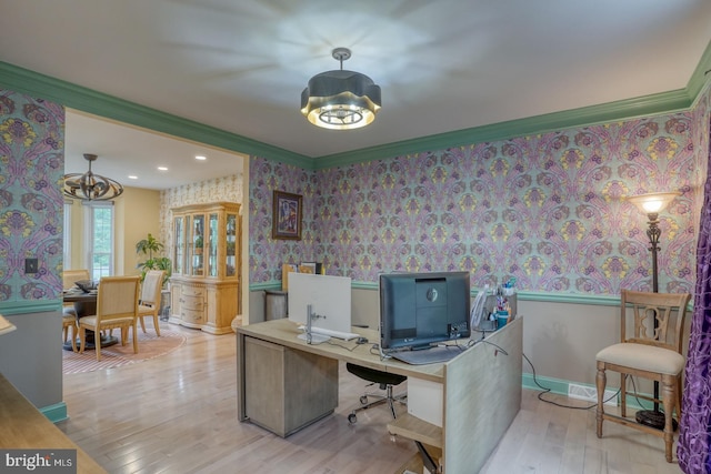 home office with wallpapered walls, wood finished floors, a chandelier, ornamental molding, and baseboards