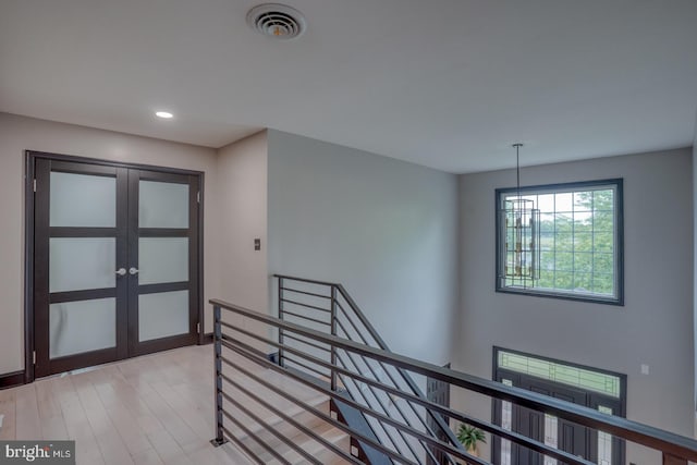 entrance foyer featuring french doors, recessed lighting, and light wood-style flooring